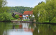 Photo: Riverside house and garden on the River Thames in England Riverside house and garden on the River Thames in England