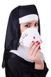 Nun playing cards on white