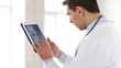 doctor working with x-ray scan on tablet pc