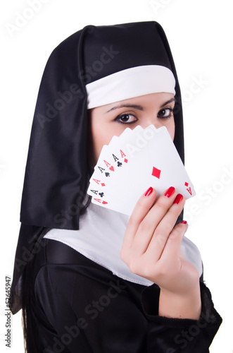 Photo: Nun playing cards on white Nun playing cards on white