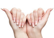 manicured hands on white