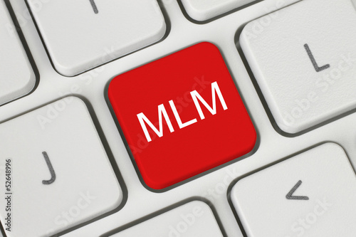 Photo: Red MLM (Multi Level Marketing) button on keyboard close-up . Red MLM (Multi Level Marketing) button on keyboard close-up .