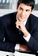 Portrait of thinkihg businessman at office