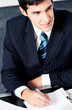 Photo: Portrait of writing businessman working at office Portrait of writing businessman working at office