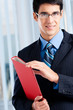 Photo: Young businessman with red folder Young businessman with red folder