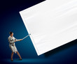 Businesswoman pulling banner