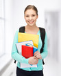 student with books and schoolbag