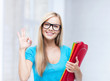 smiling student with folders