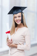 Photo: student in graduation cap with certificate student in graduation cap with certificate