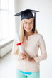 student in graduation cap with certificate