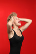 Fashion woman shouting with her hands on the head