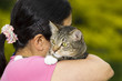 Photo: Matue woman holding her Family Cat Matue woman holding her Family Cat