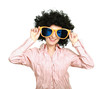 Young woman wearing afro wig and big glasses