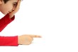 Young boy with his hand on his face pointing  to something