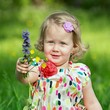 Cute little girl in a meadow full of flowers