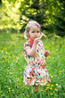 Portrait of a little girl with a lollipop