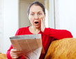 fright  woman with newspaper
