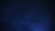 Abstract blue smoke in darkness