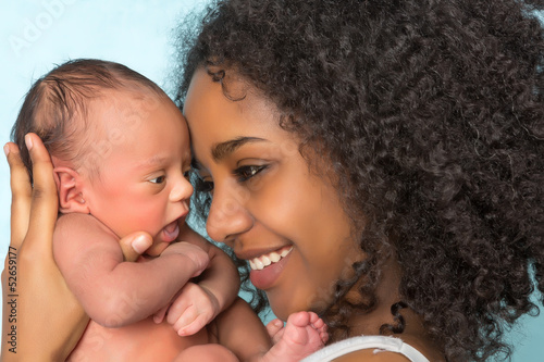 Photo: Smiling african mother and baby Smiling african mother and baby