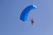 parachute flyier on clear blue sky