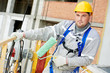 Photo: Portrait of builder facade painter at work Portrait of builder facade painter at work