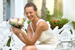 Portrait of a laughing woman with a bouquet of flowers.