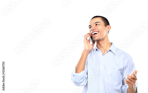 Photo: young smiling black businessman talking on cell phone young smiling black businessman talking on cell phone