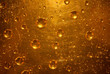 Metal texture with scratches and drops of gold color