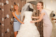 Two girlfriends Having fun in bridal Boutique