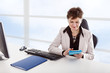 Businesswoman in office with tablet PC