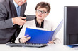 Chief looks together with staff in file folders