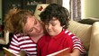 Mother and son reading picture book