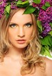 Photo: Young beautiful girl wearing lilac chaplet Young beautiful girl wearing lilac chaplet