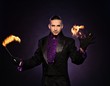 Young brunette magician in stage costume 