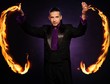 Young brunette magician in stage costume 