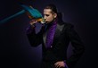 Photo: Young handsome brunette magician man Young handsome brunette magician man