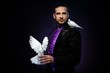 Foto: Young handsome brunette magician man Young handsome brunette magician man
