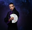 Young brunette magician in stage costume 