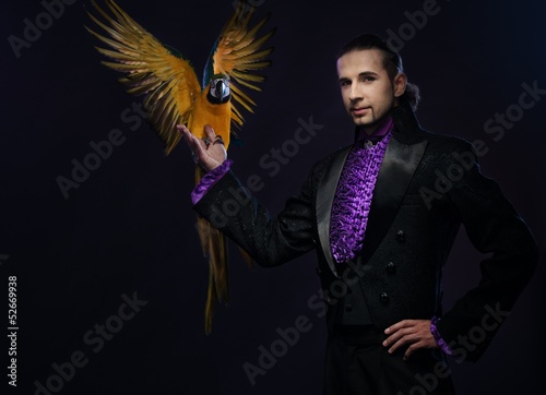 Photo: Young handsome brunette magician man Young handsome brunette magician man