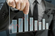 Photo: Business man presenting interactive graph Business man presenting interactive graph