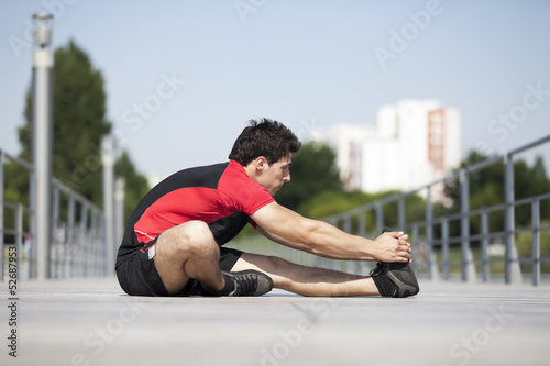 Photo: Athlete warming and stretching Athlete warming and stretching