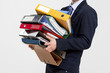 Business man carrying folders