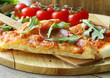 Pepperoni pizza with tomato sauce and herbs