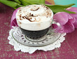 Composition of coffee and tulips, on color background
