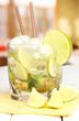 Glass of cocktail with lime and mint