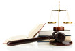 Golden scales of justice, gavel and books isolated on white