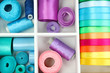 Material for sewing in white wooden box closeup