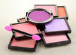 Bright eye shadows and sponge brushes for foundation