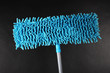 Blue mop for floor on gray background