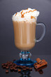 Foto: Layered coffee in glass on table on grey background Layered coffee in glass on table on grey background